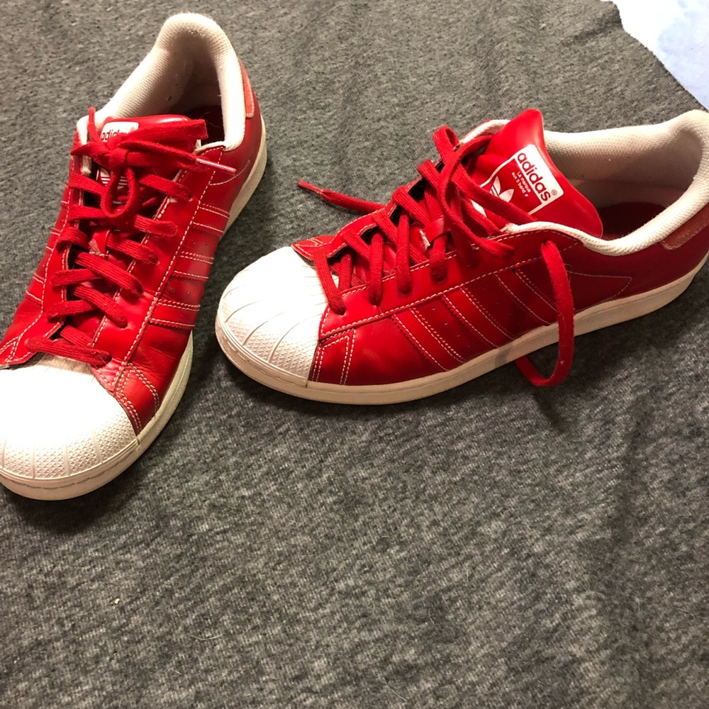 Adidas superstars. Red/white. 10.5. Tiny stain.